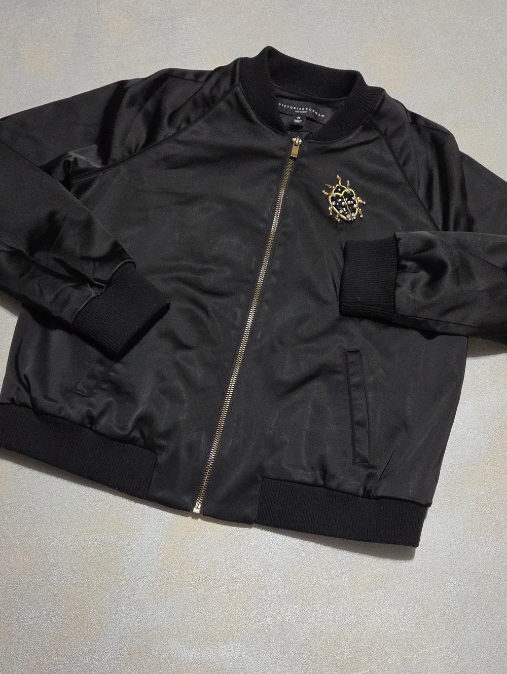 Victoria Beckham Black Satin Bomber Jacket with Gold Crest Ladybugs